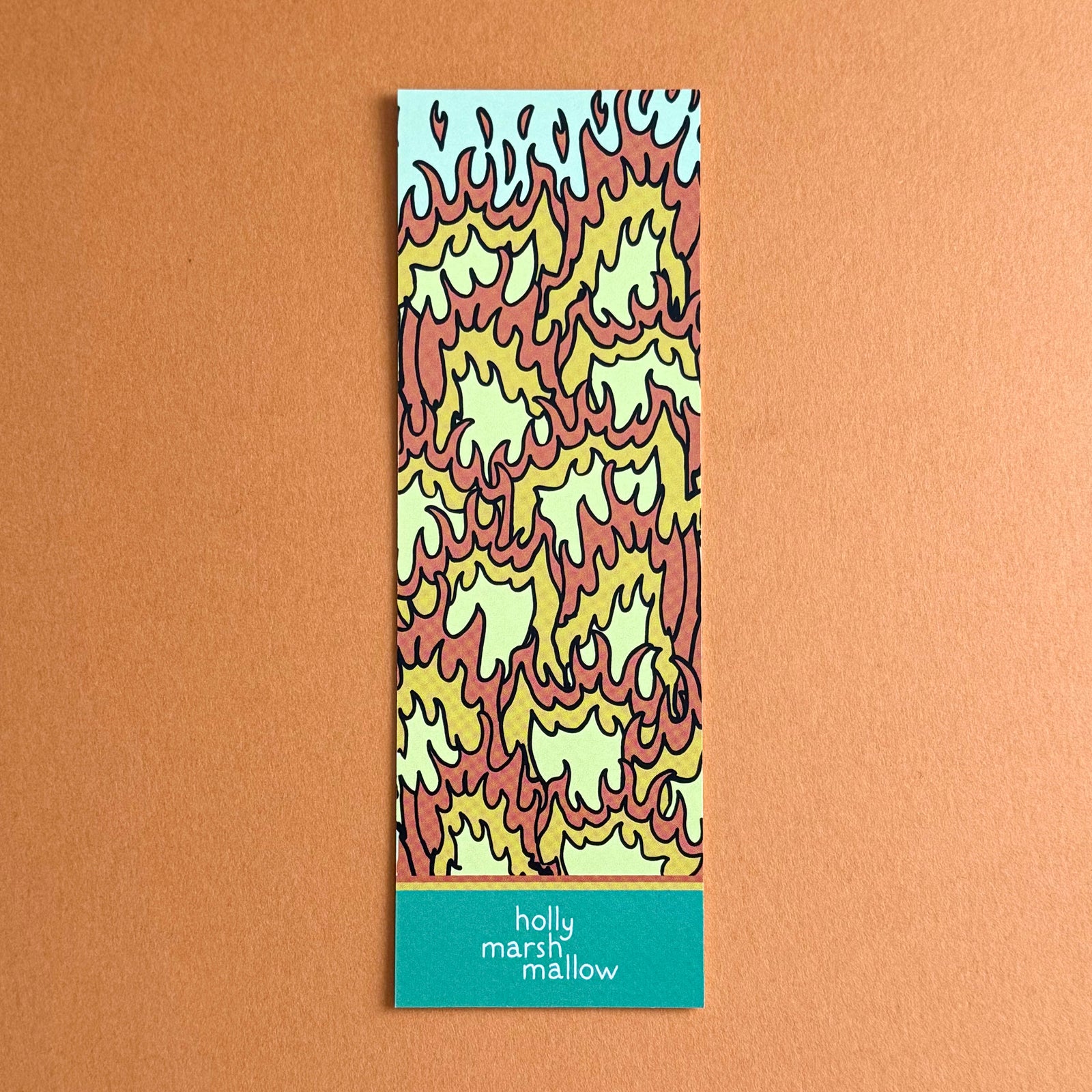 Back of Dumpster Fire bookmark. It is a repeat pattern of hand drawn flames. Bookmark is on a solid orange background.