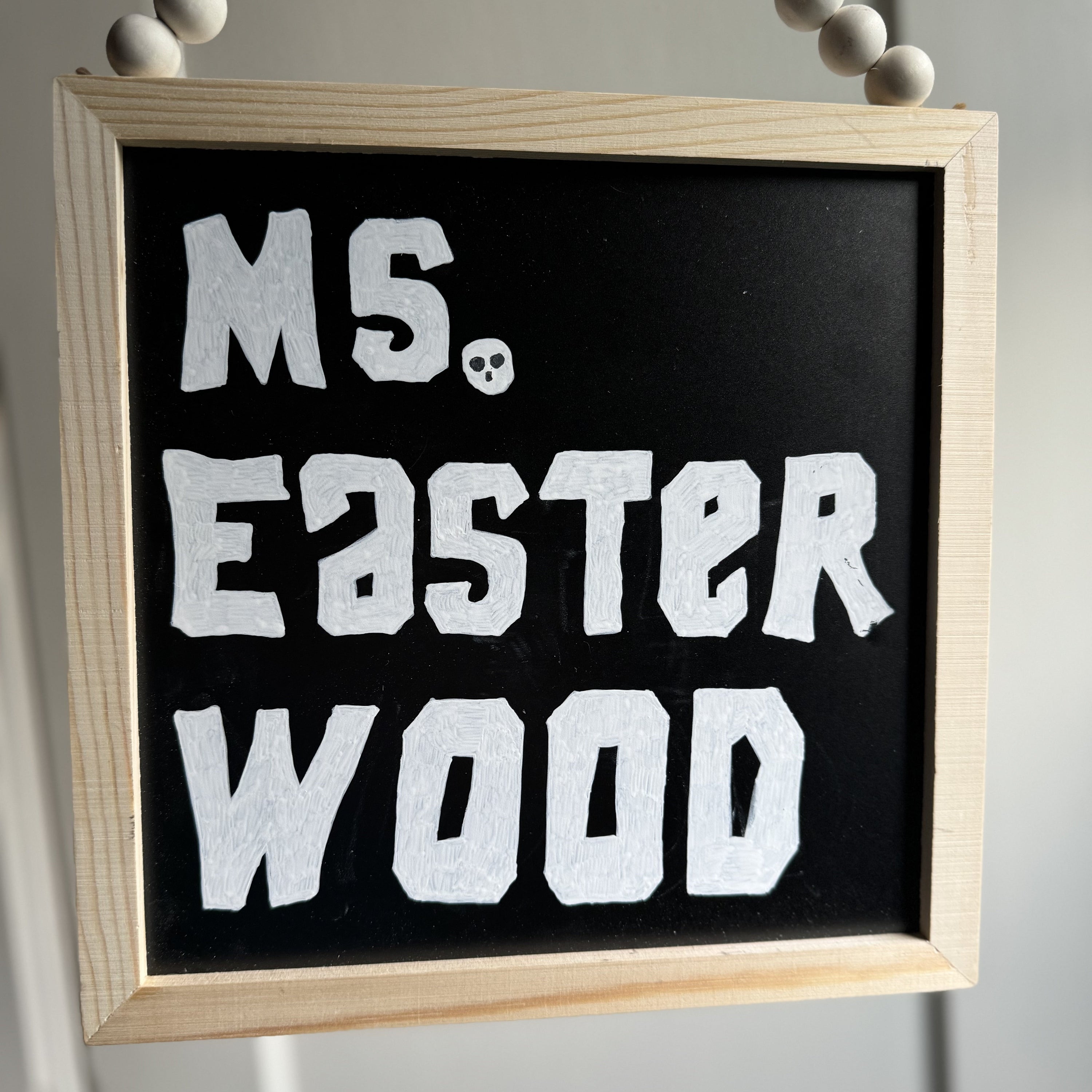 Chalkboard with Goonies-inspired hand lettering for a teacher