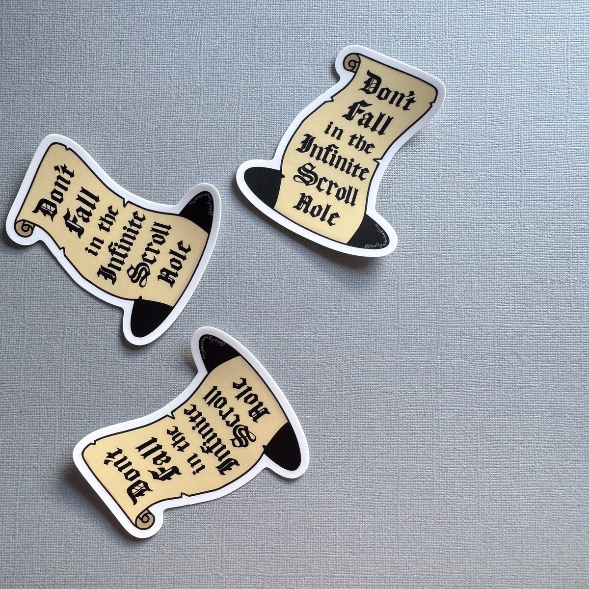 three infinite scroll hole stickers
