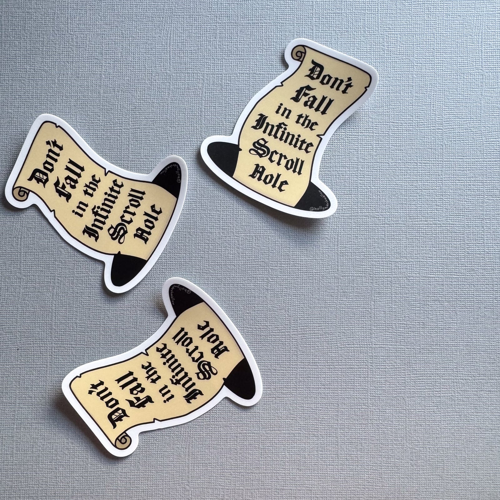 three infinite scroll hole stickers