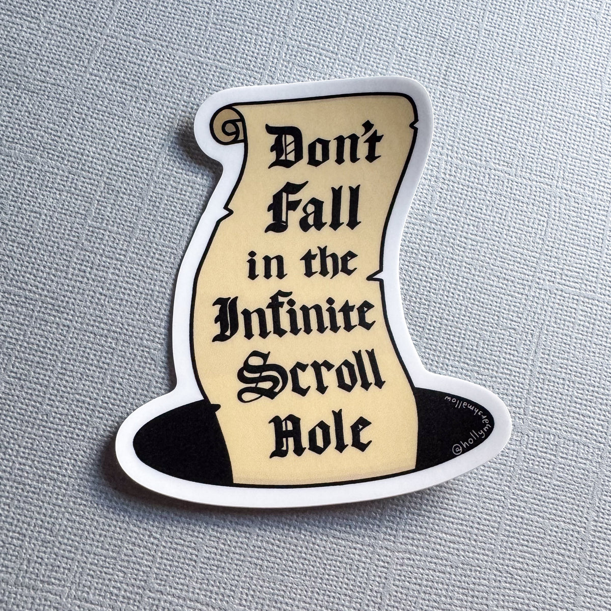 a single infinite scroll hole sticker on a grey background