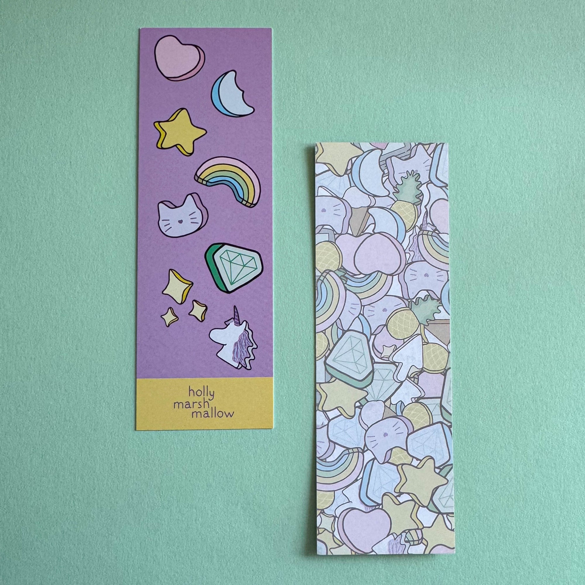 Two colorful bookmarks with illustrations on a light green background
