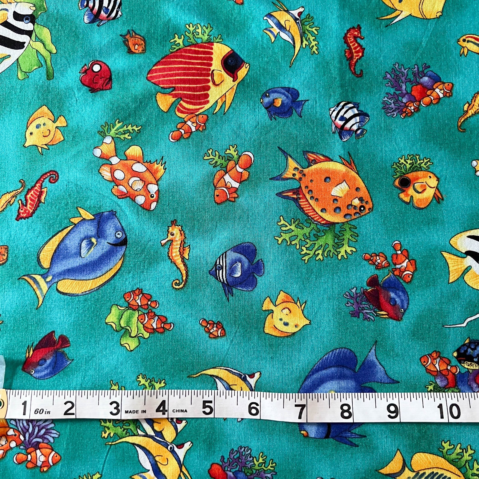 Tropical Reef Fish in Green Fabric by Paul Brent