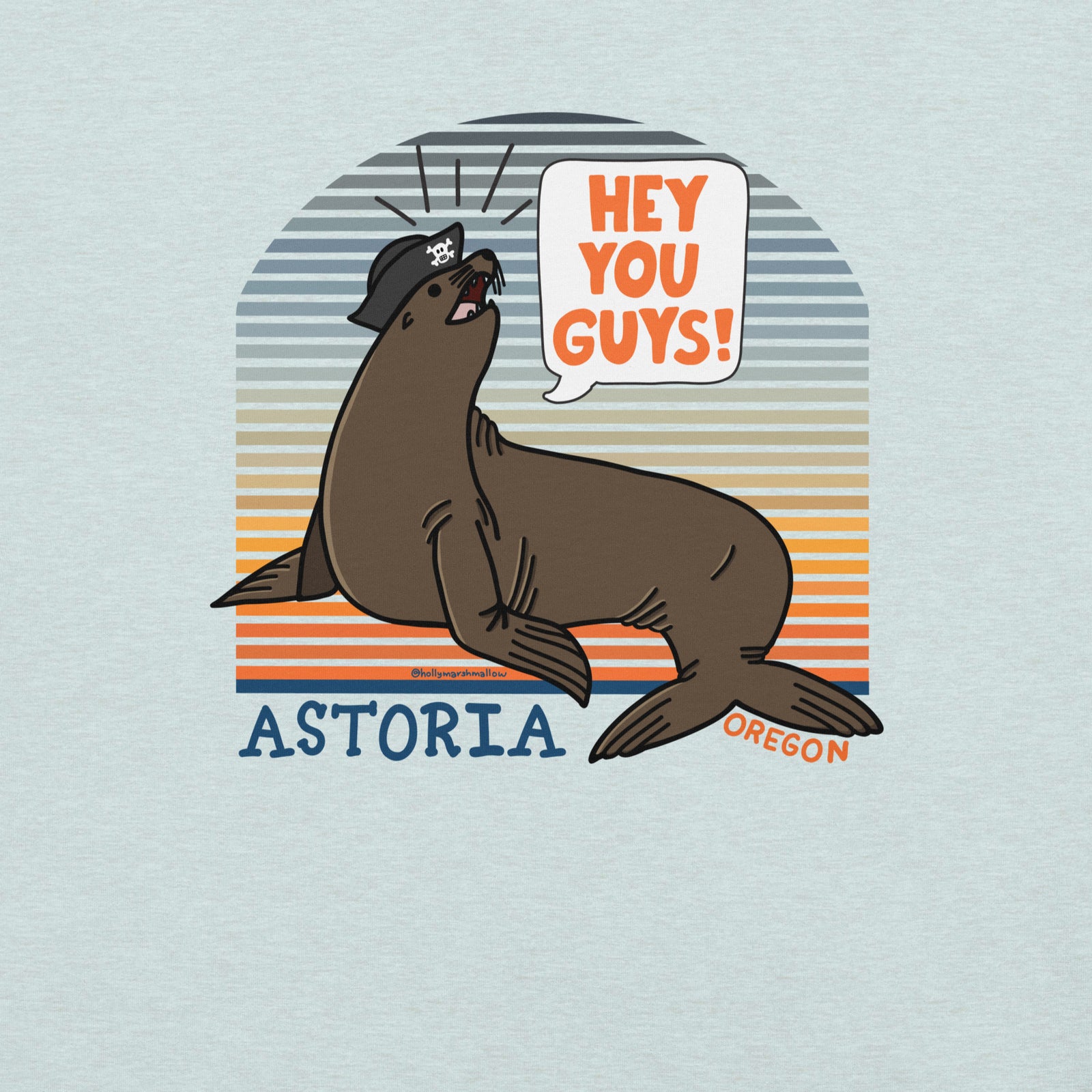 A close up of an ice blue t-shirt of a sea lion in a tricorn hat yelling HEY YOU GUYS with a sunset stripe background and hand-lettered Astoria, Oregon on the bottom