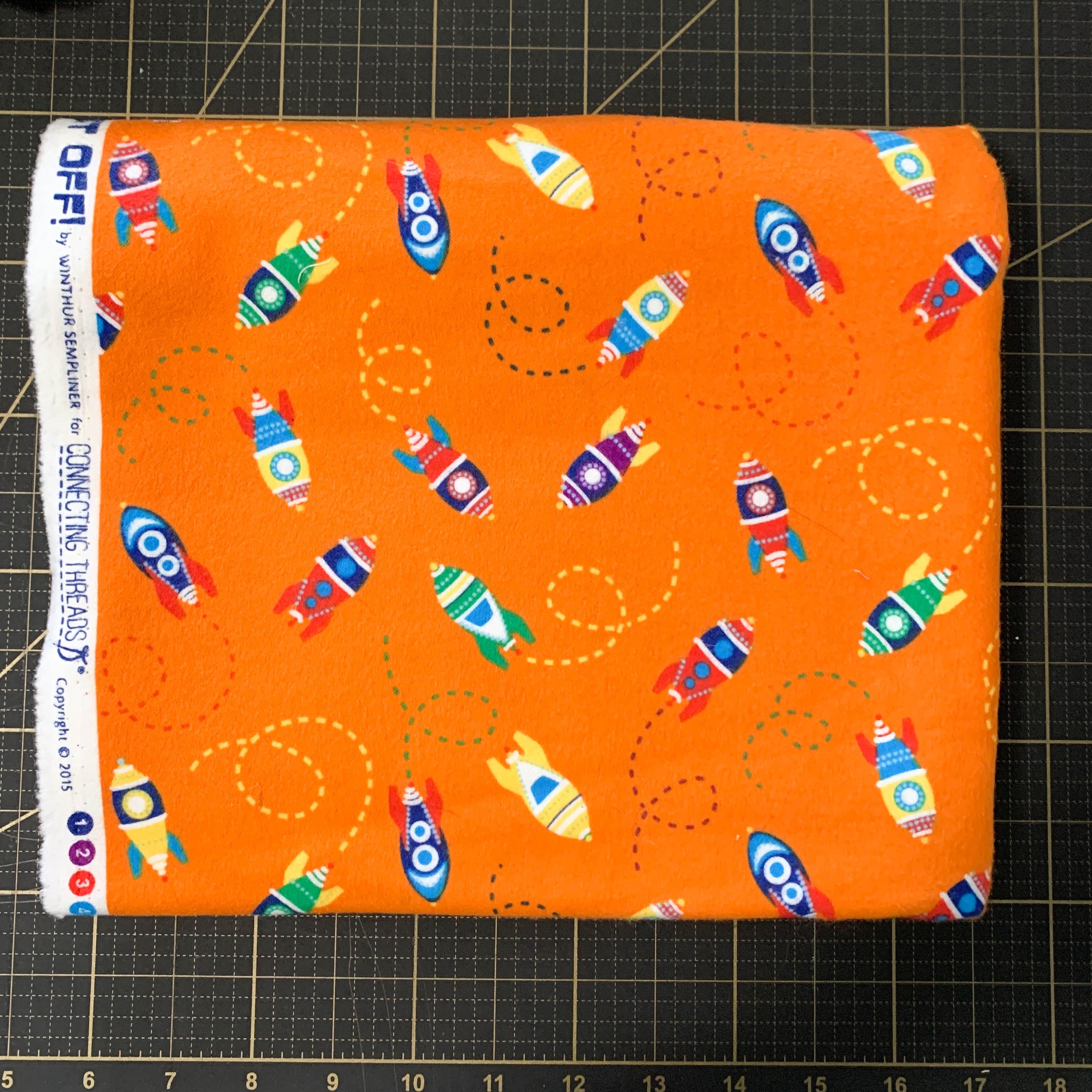 Blast Off! Orange Flannel - Out of Print - 1 Yard